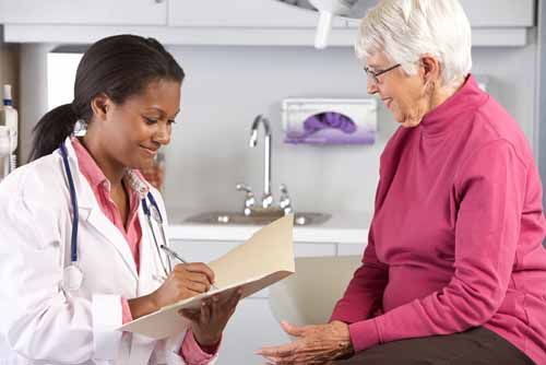 A nurse helps a patient